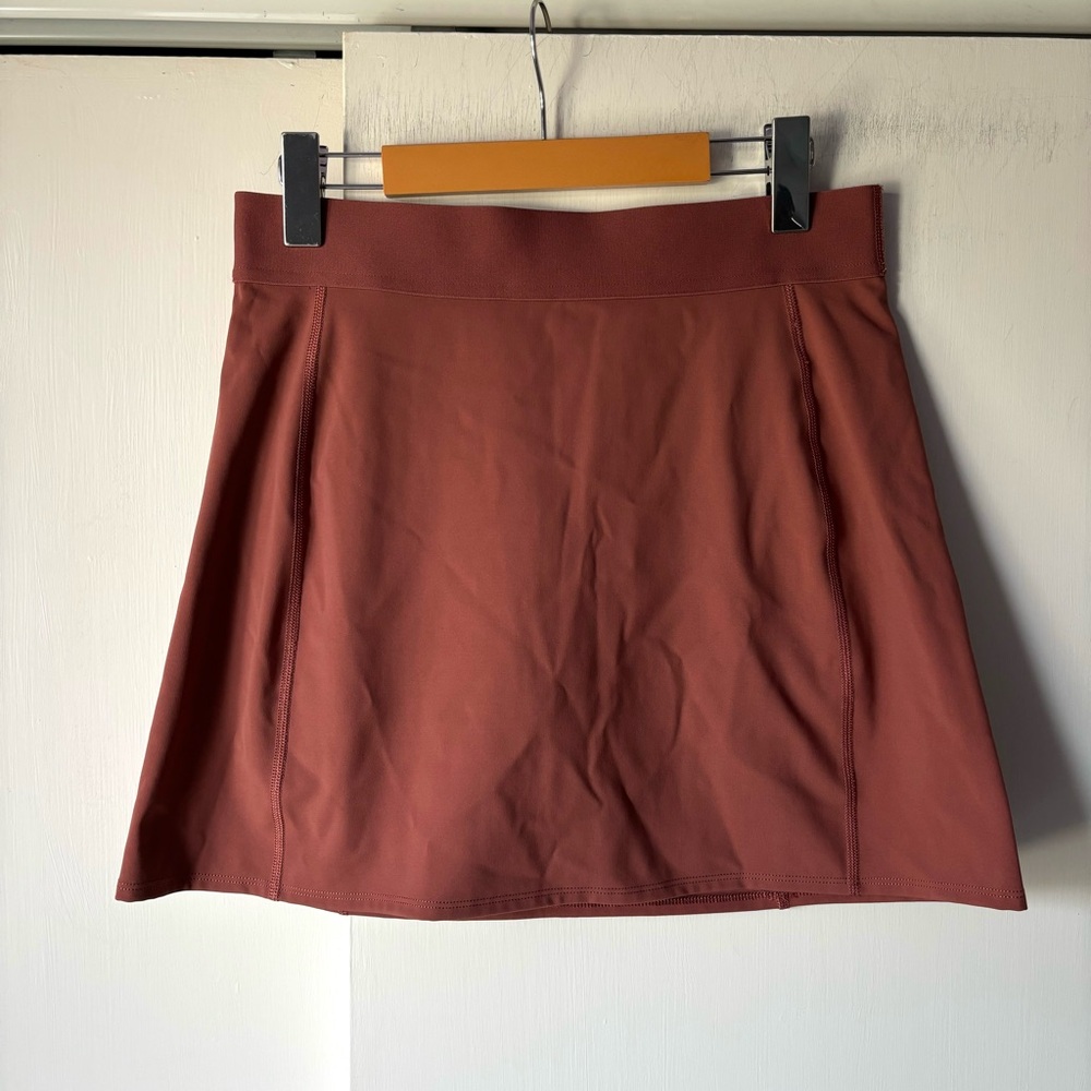 Aritzia TnaSLICK™ Court Mini Skirt in Mauve Pink